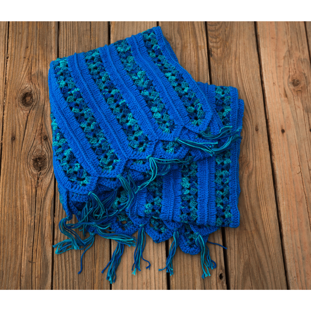 Blue crochet blanket folded