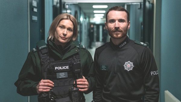 Actor Sian Brooke as Grace and actor Martin McCann as Stevie in Blue Lights season 3. (Photo Credit: Peter Marley/Courtesy of BritBox.)