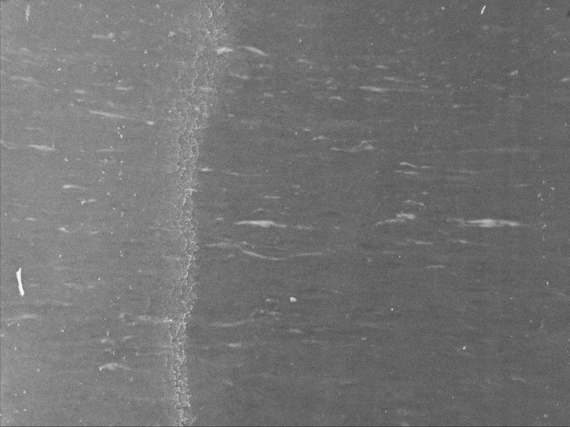 waves raised by wind on the North Atlantic ocean, visibly scratched image tainted by oil of cotoneaster 