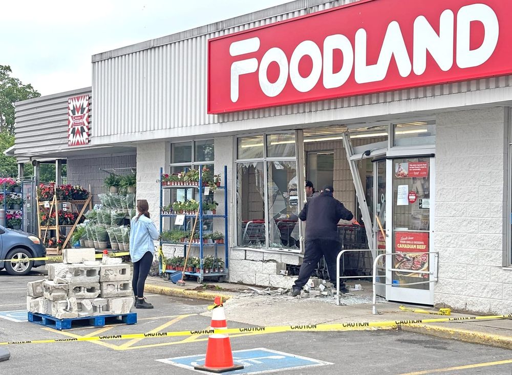 Vehicle smashes into front of local grocery store post image