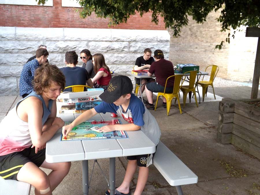 Taking turns at outdoor board game night in Harriston post image