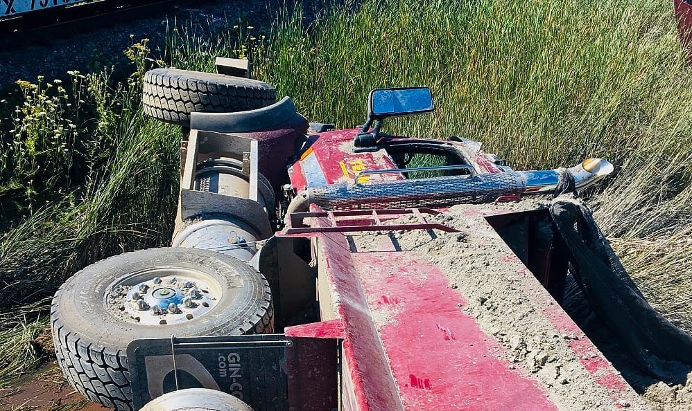 Truck driver charged following Aug. 14 collision at railway crossing in Puslinch post image