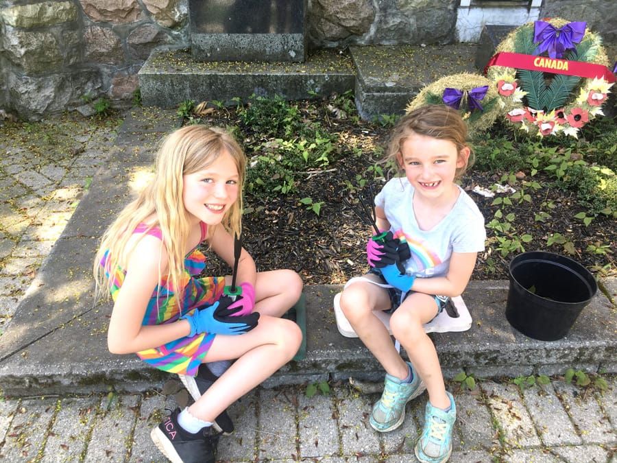 Junior gardeners helped plant in Arthur's public gardens post image
