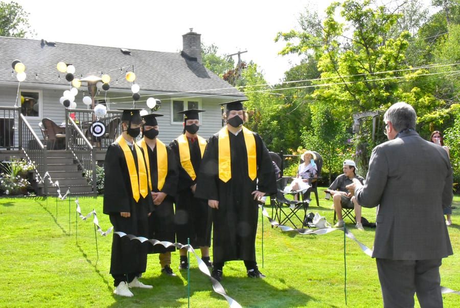 Family holds backyard graduation ceremony post image