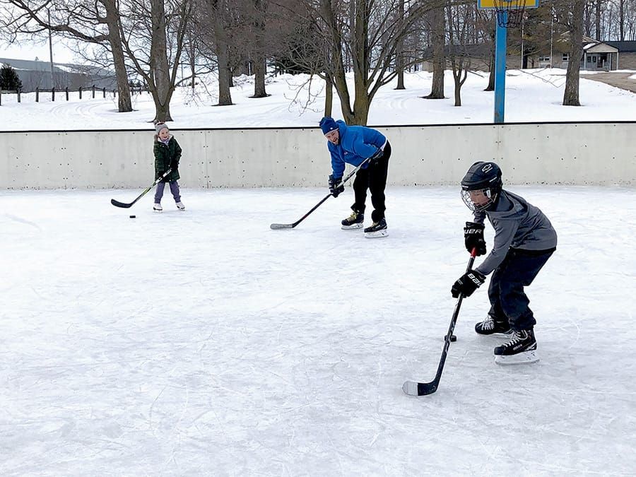 Passing the puck at the Moorefield Optimist Club's outdoor rink post image