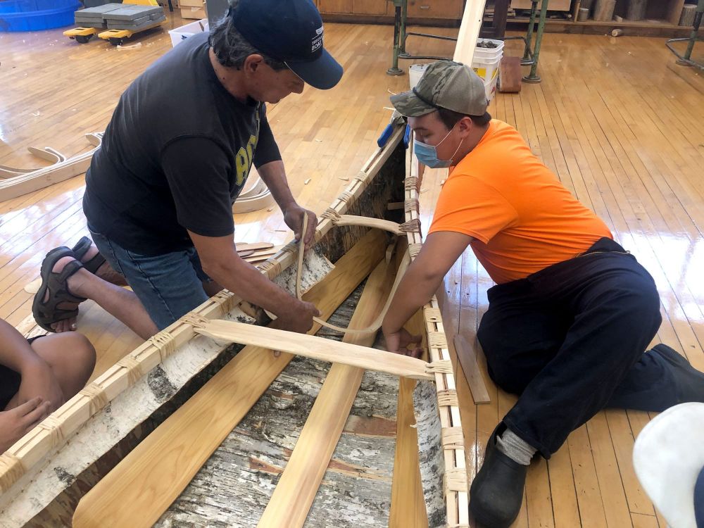 Local Indigenous students participate in traditional birch bark canoe build post image