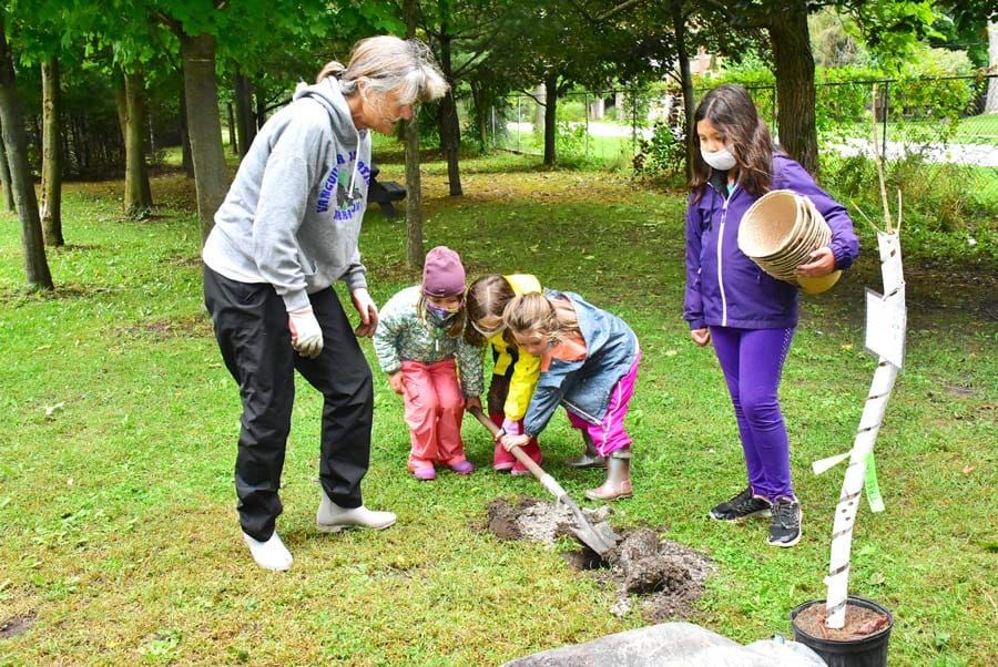 Students help plant trees at Elora Centre for the Arts post image