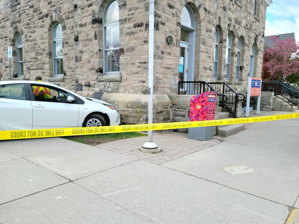 Vehicle runs into pedestrian, library post image