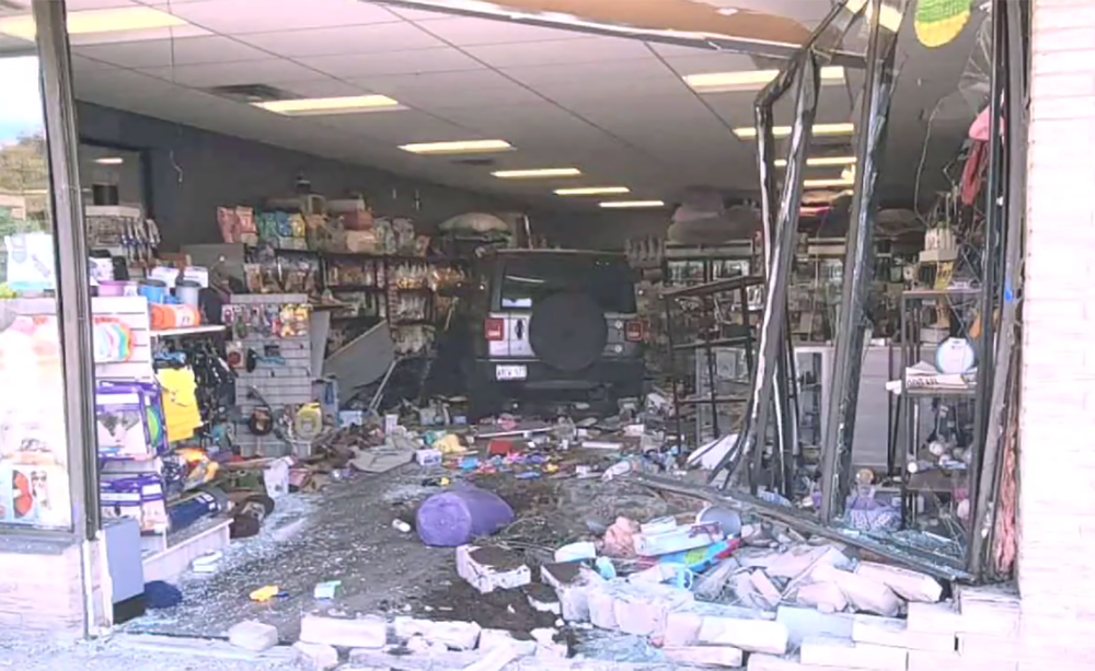 Vehicle crashes through front entrance of Erin business post image