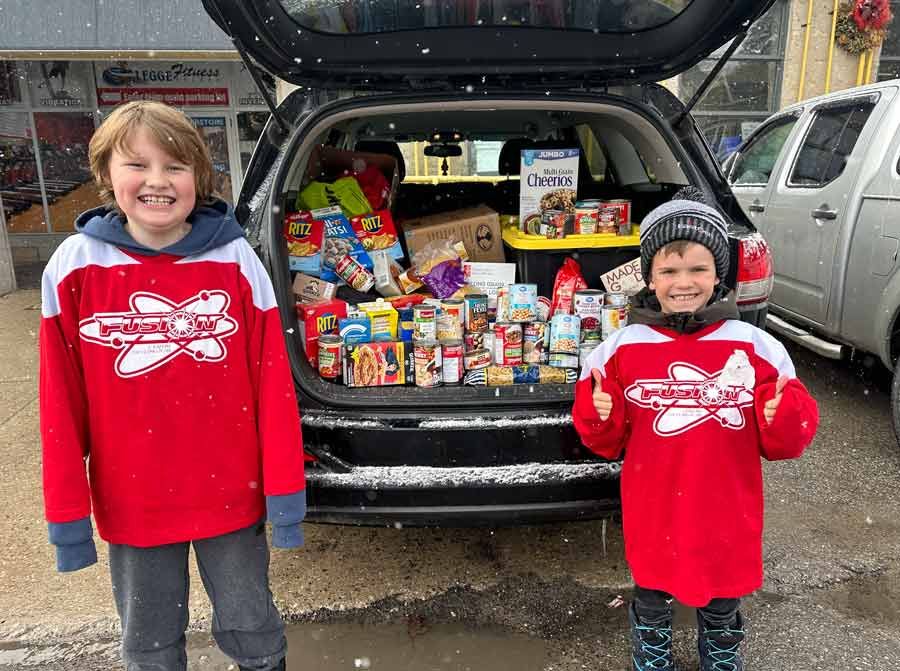 Centre Wellington Fusion hockey players donate to local Food Bank post image