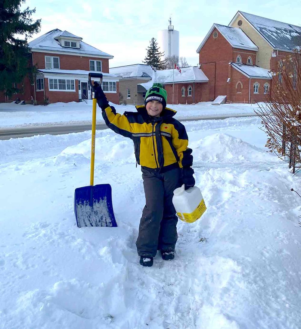 Nine-year-old hard at work shovelling snow for neighbours post image