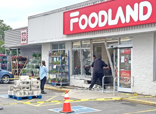 Vehicle smashes into front of local grocery store post image