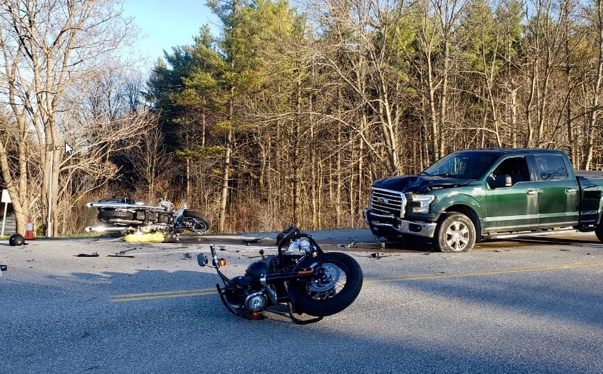Man dead following crash between pickup, two motorcycles