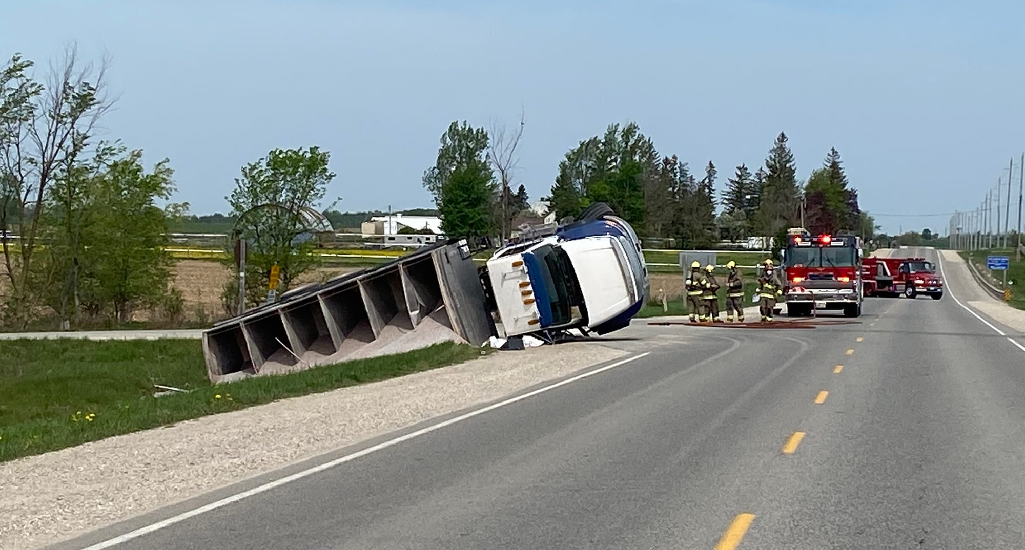 Driver receives minor injuries after truck rolls into ditch