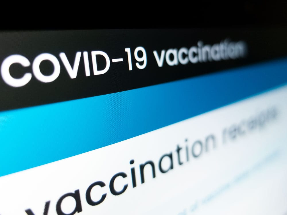 What do vaccine certificate checks and enforcement look like in the county?