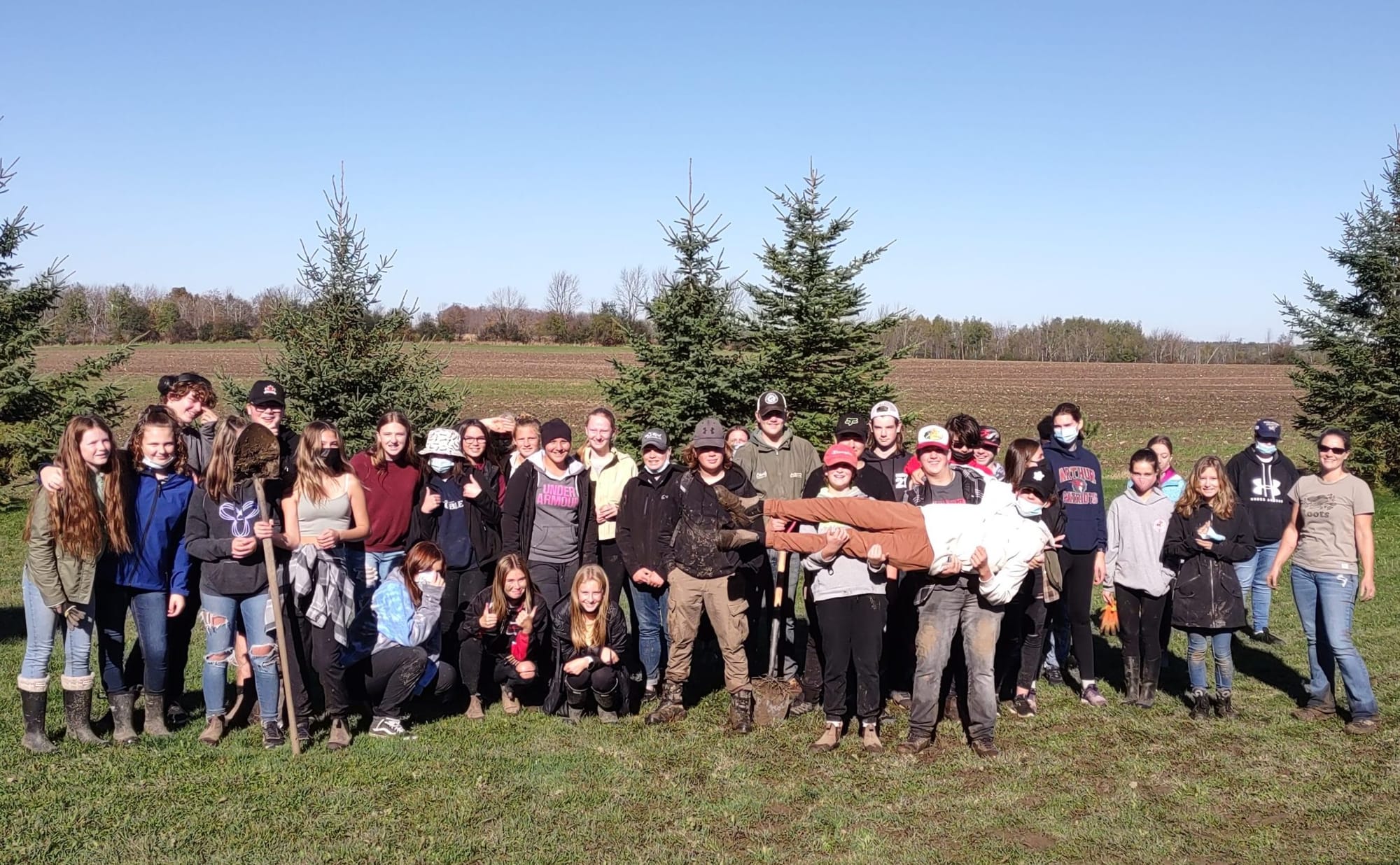 Students, staff transplant 80 trees on high school property