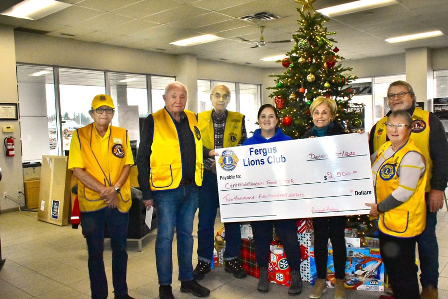 Fergus Lions and Reliable Ford make holiday donation to Centre Wellington Food Bank