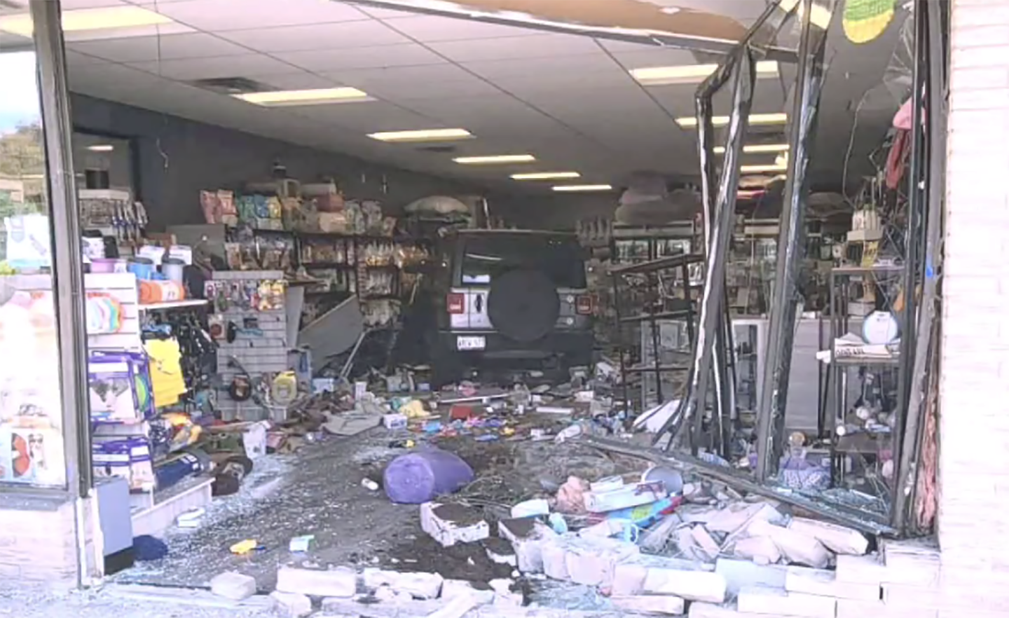 Vehicle crashes through front entrance of Erin business