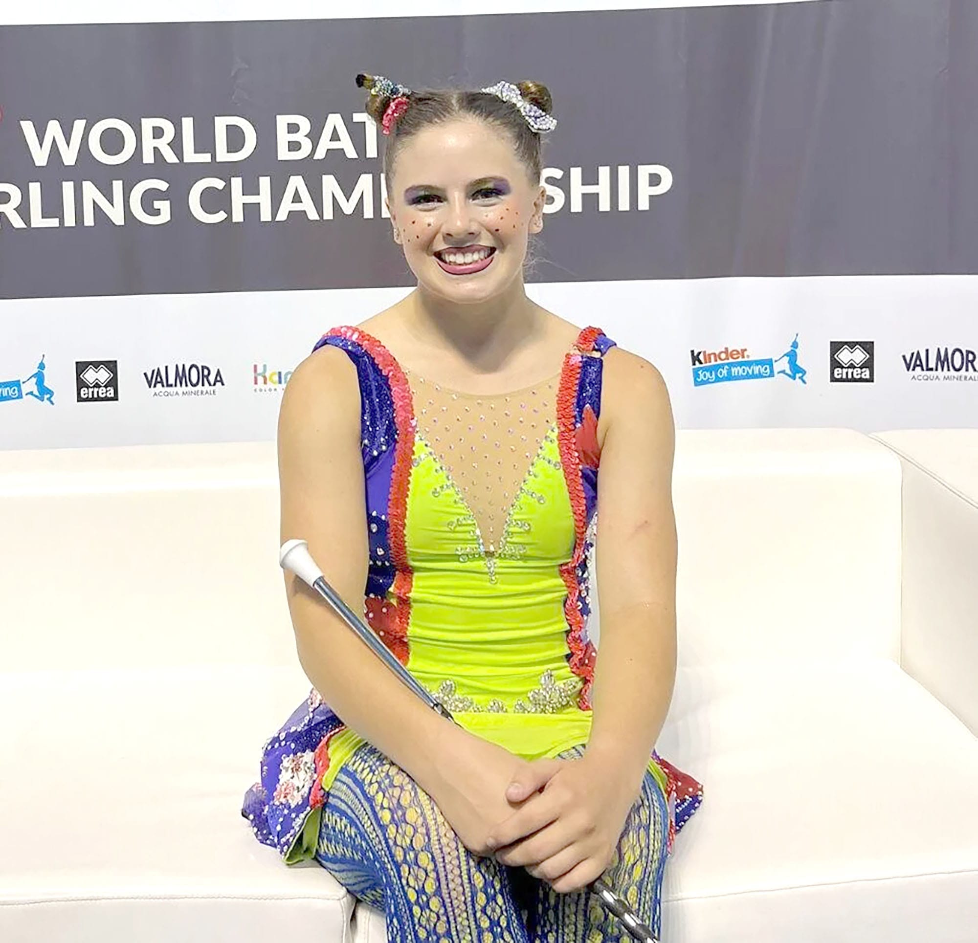 Student baton twirler graduates with scholarship