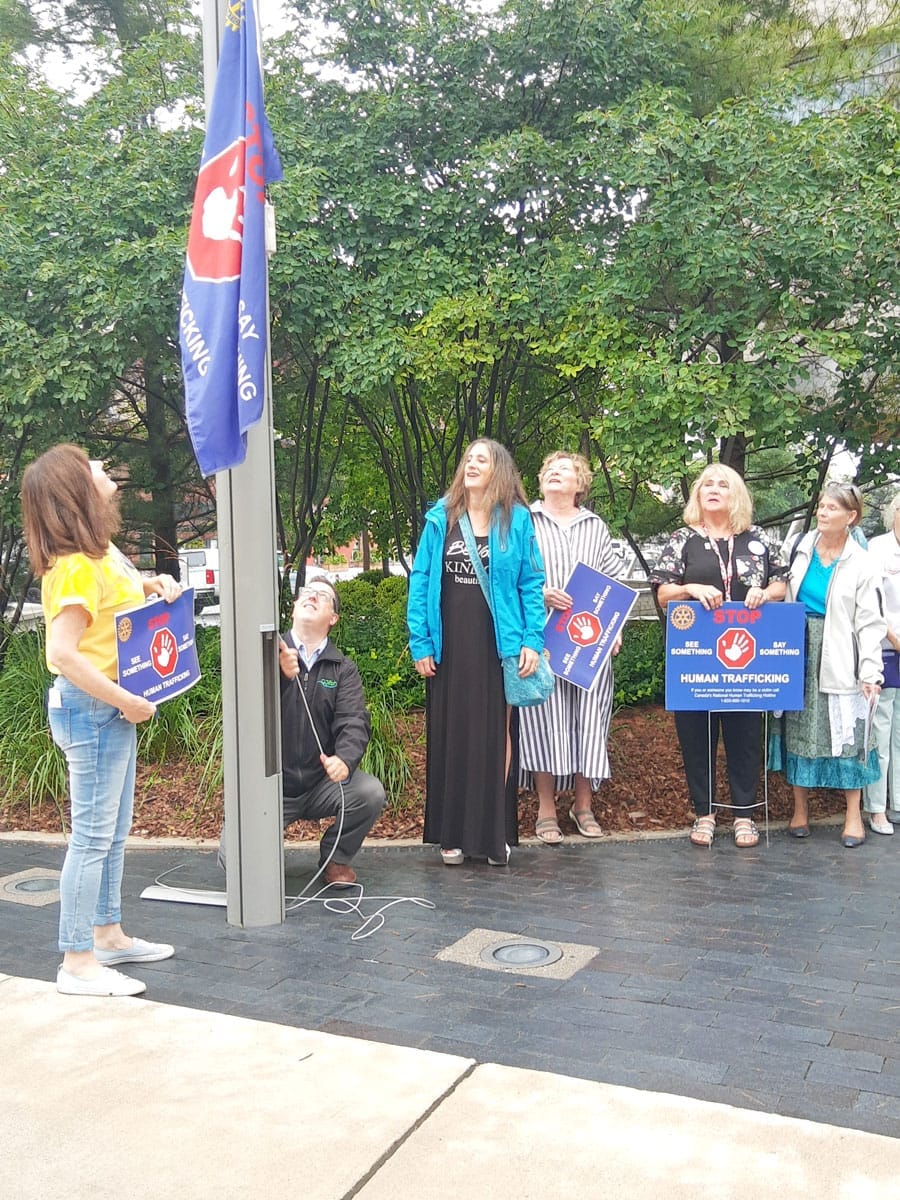 Raise a flag, post a sign, Stop human trafficking