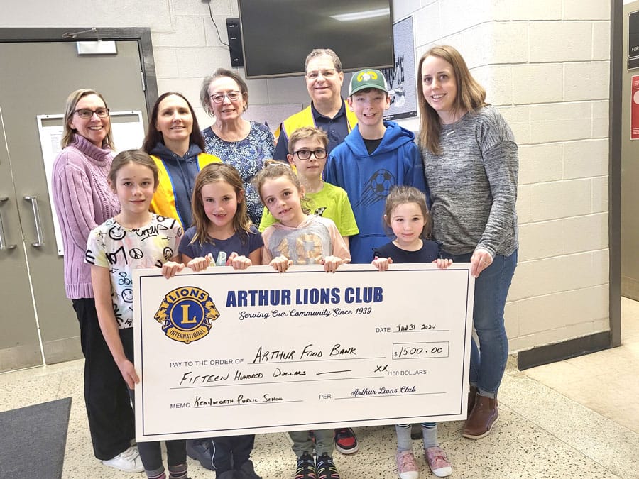 Lions Club presents a $1,500 donation to the Arthur Food Bank