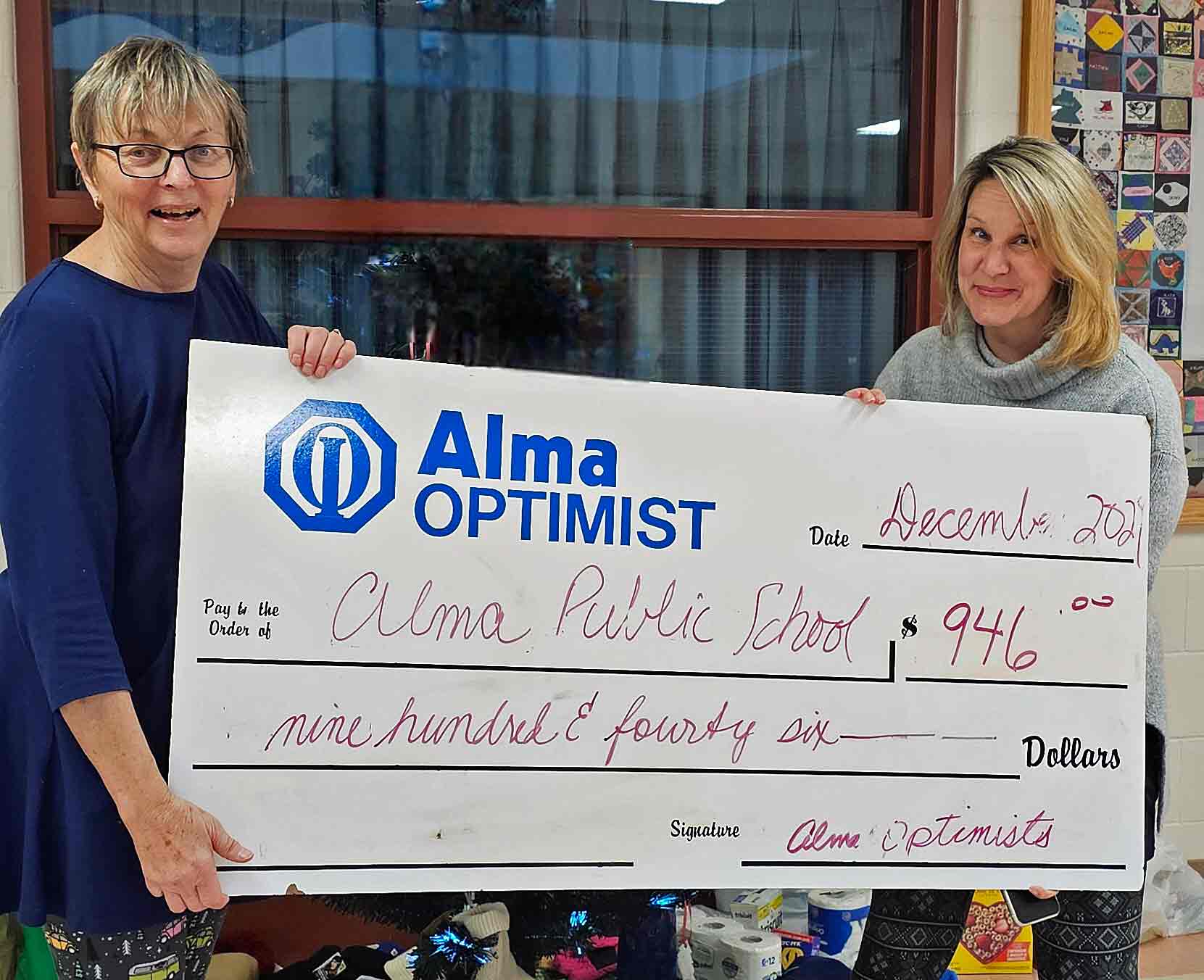 Alma Optimist Club donates $900 to Alma Public School