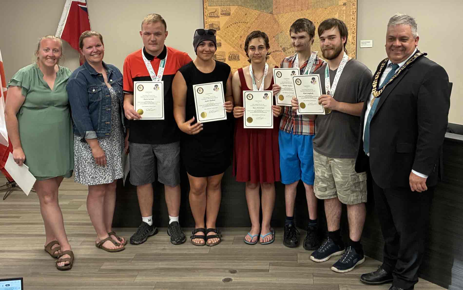 WHSS Special Olympics Bocce Team receive recognition certificates from township