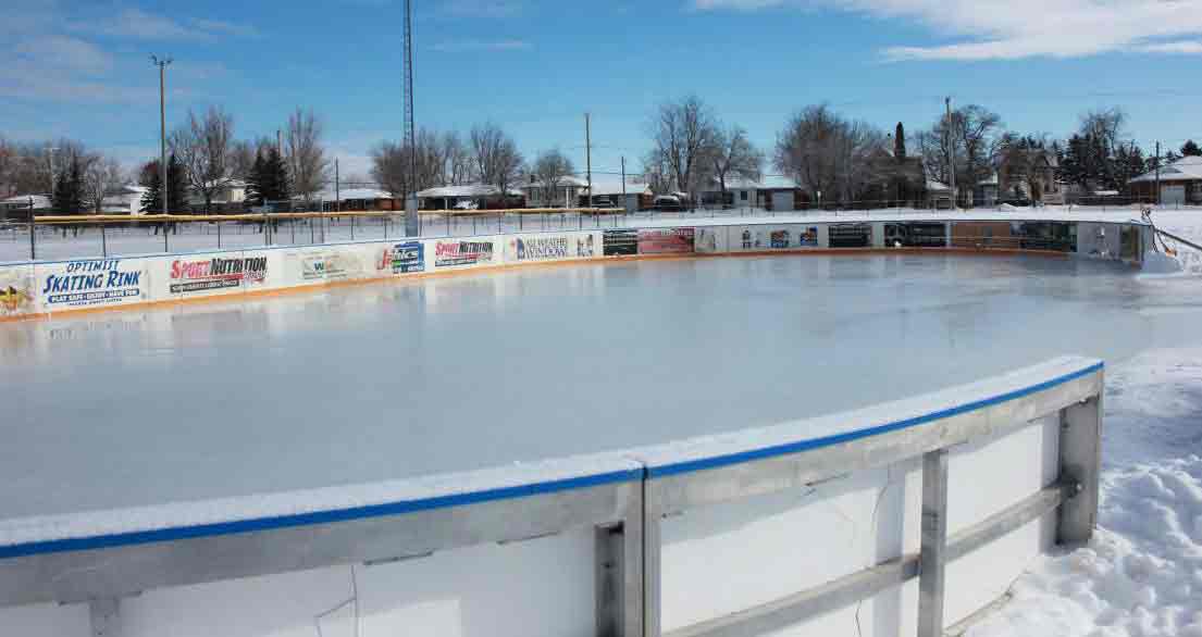 Volunteers work hard on outdoor skating rinks