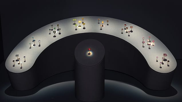 A group of wine glasses on a black surface
AI-generated content may be incorrect.