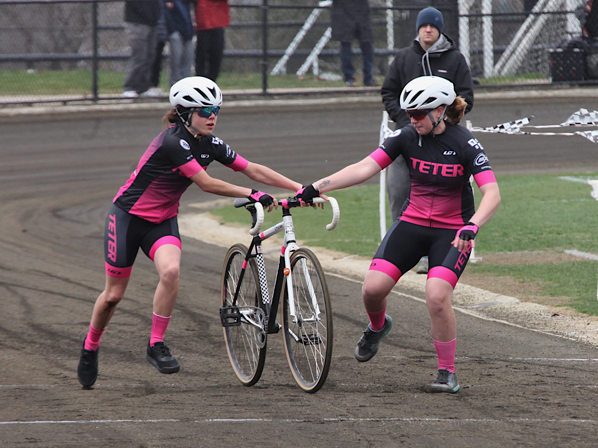 riders exchanging bicycles in qualifications for a race