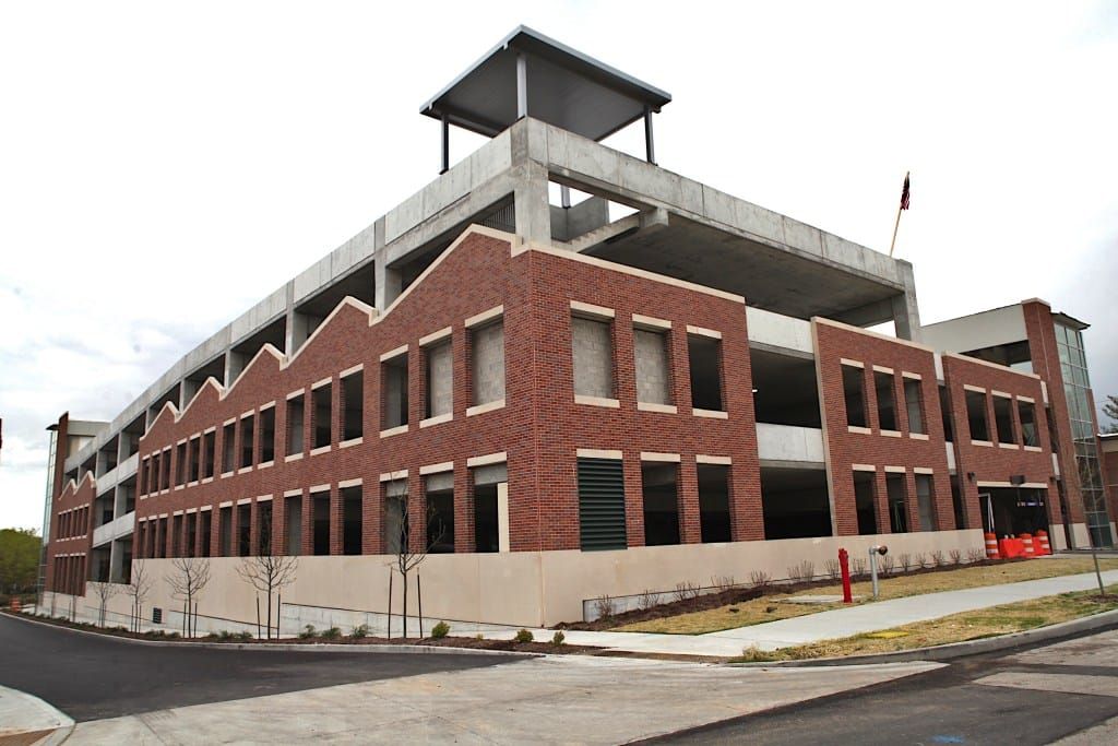 Parking garage ribbon cutting marks transition, a prelude to hoped-for development