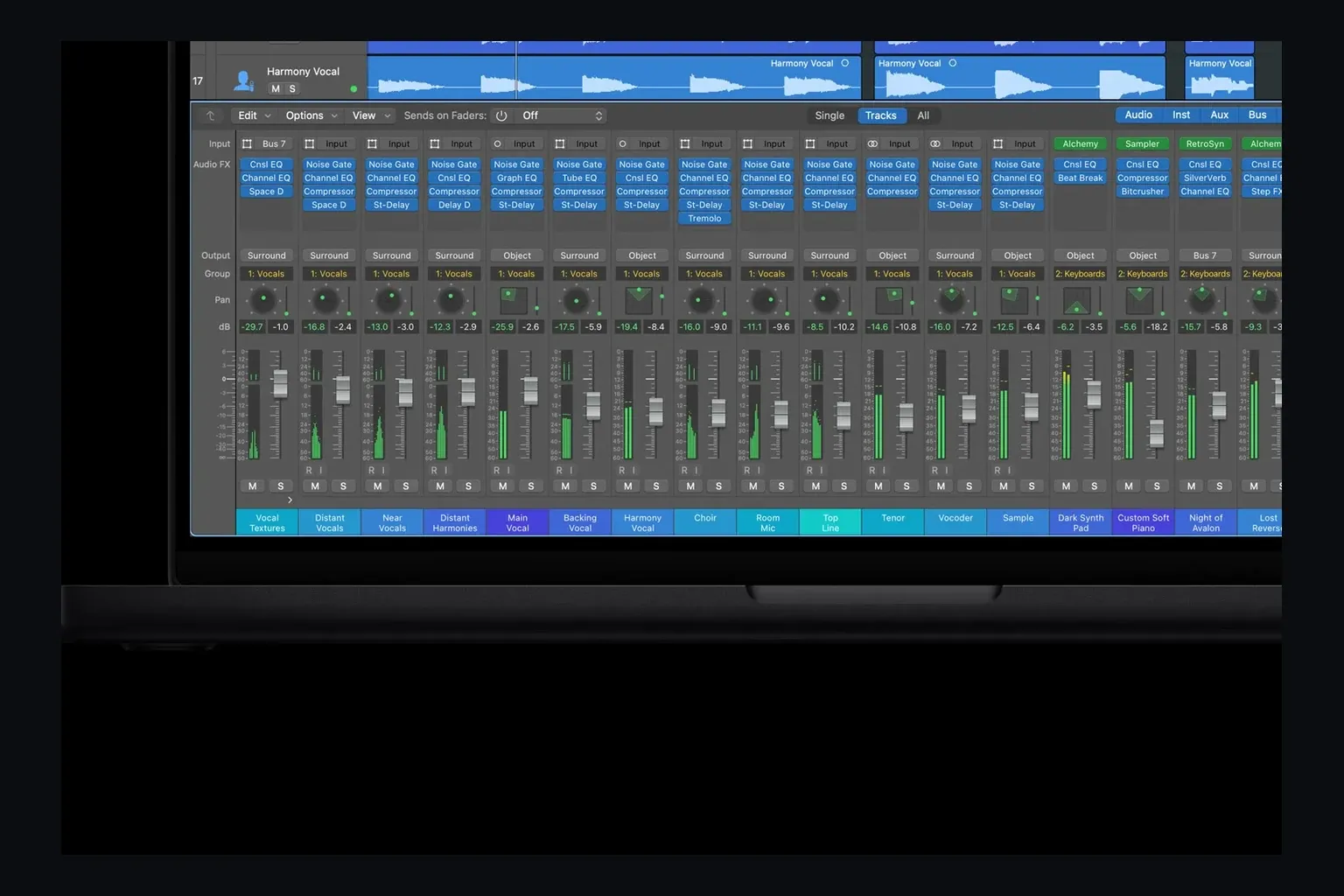Logic Pro mixer with channel strips, plug-in inserts, sends and buses