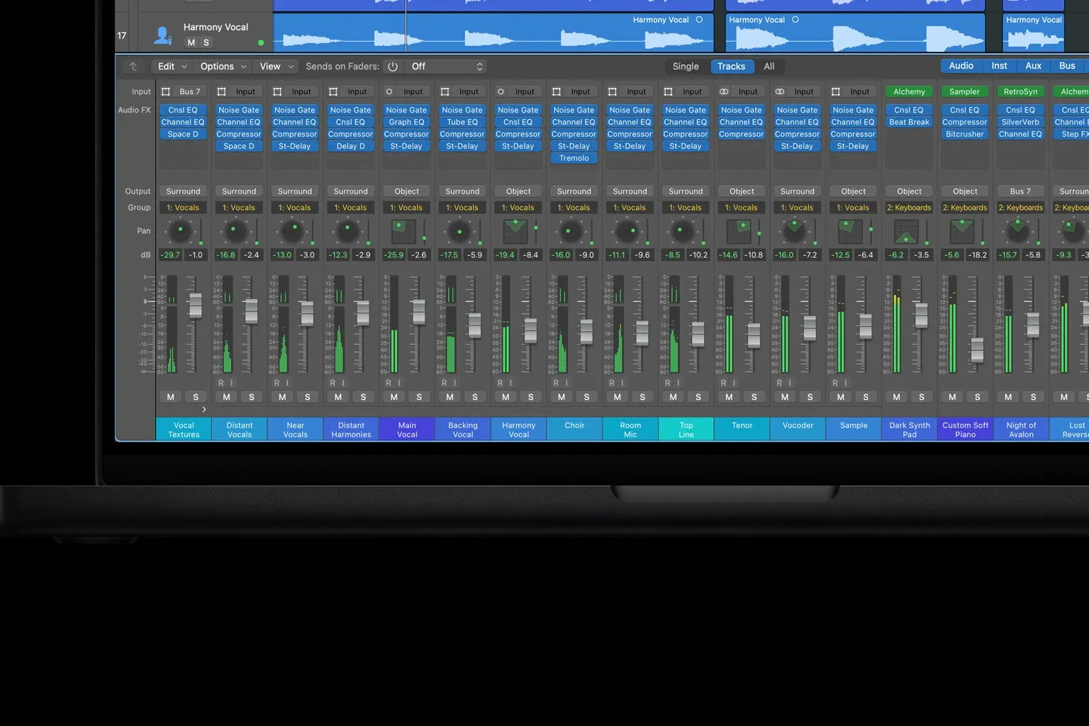Logic Pro mixer with channel strips, inserts, buses, surround routing and level meters