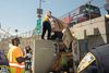 Sanitation workers and NYPD clear out a homeless encampment at the base of Manhattan Bridge