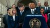 Mayor Eric Adams of New York City introuces Sanitation Commissioner Jessica Tisch, standing next to the lectern, as his choice for police commissioner at CIty Hall