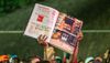 A person holds up a photo of 1520 Sedgwick Avenue and the flier for the first hip-hop jam during a celebration for the fiftieth anniversary of hip-hop on August 12, 2023 in The Bronx borough