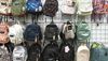 20 backpacks hanging in a store