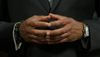 Close up image of Mayor Adams' hands with fingers touching 