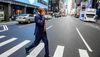 New York City Mayor Eric Adams walks to the subway in midtown Manhattan on his phone, on his second day in office in 2022.