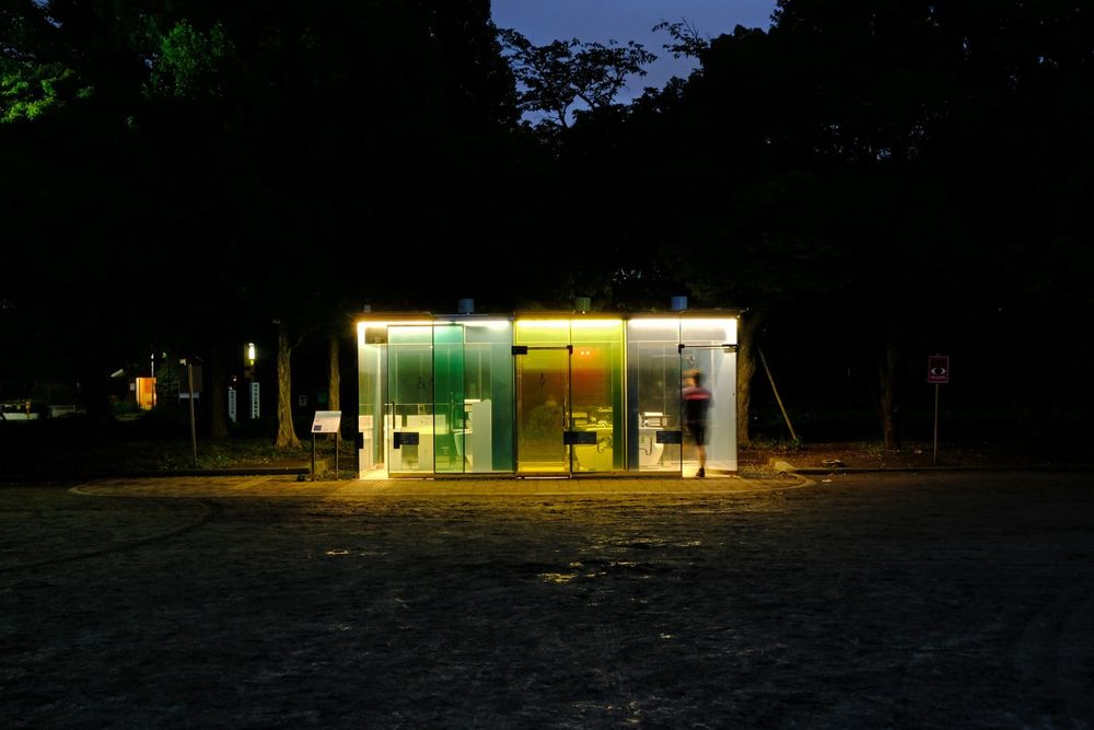A public bathroom designed as part of the Tokyo Toilet art project is illuminated at night