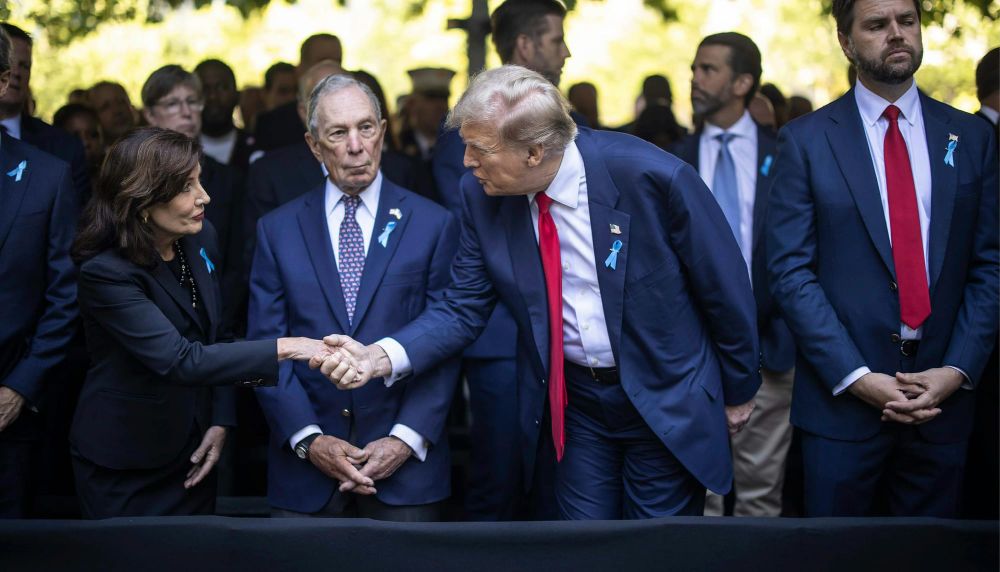 New York Gov. Kathy Hochul shakes hands with former President Donald Trump at a ceremony