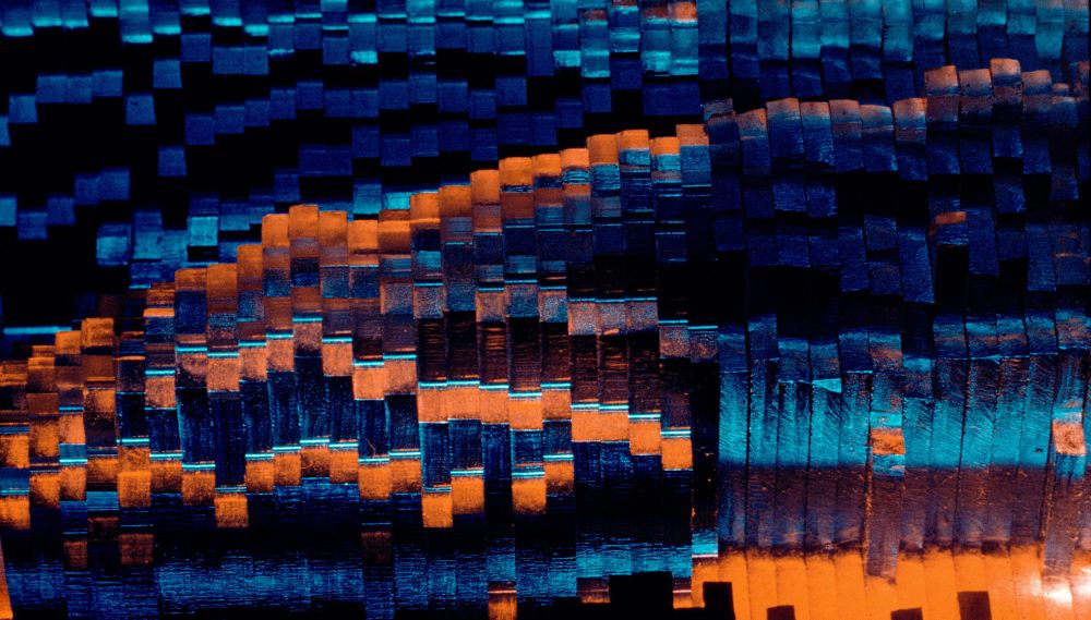 Abstract blue and orange image created by Shapes of Sound, an IBM voice recognition study