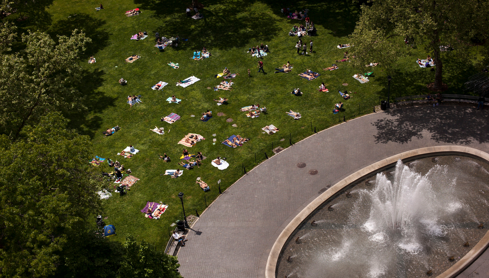 An overhead shot of sunbathers gathered next to the fountain in Manhattan's Stuy Town development
