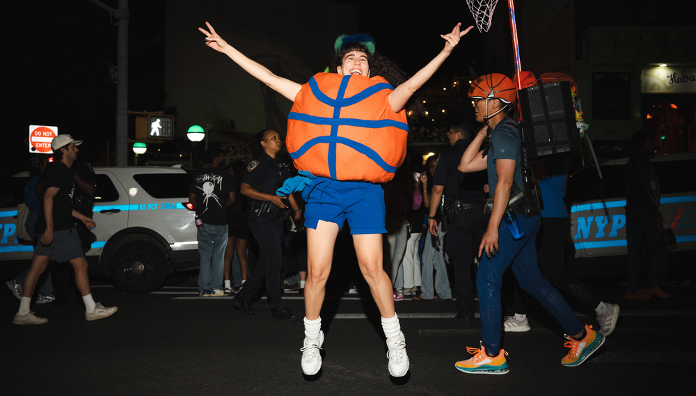 A fan in a basketball costume celebrates the New York Knicks' championship victory.