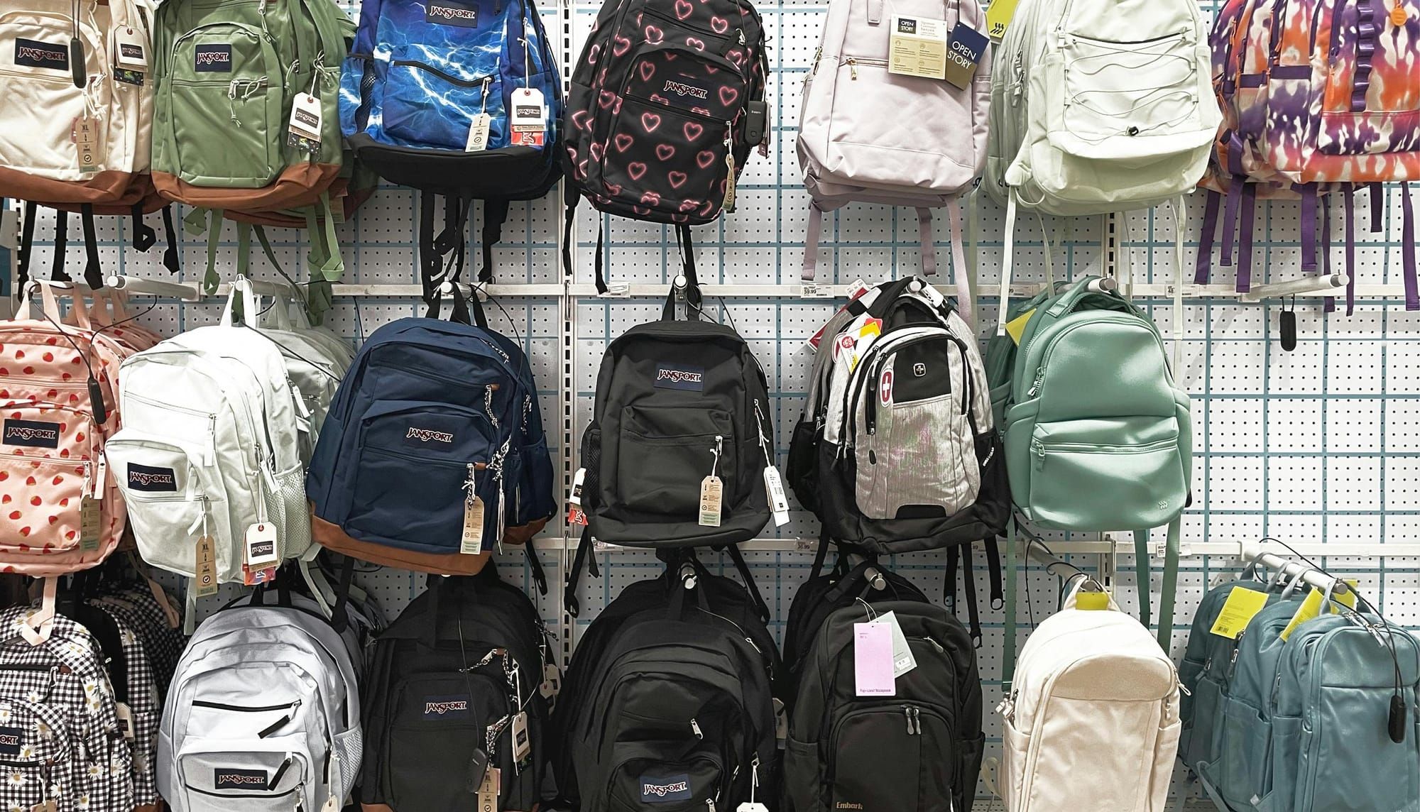 20 backpacks hanging in a store