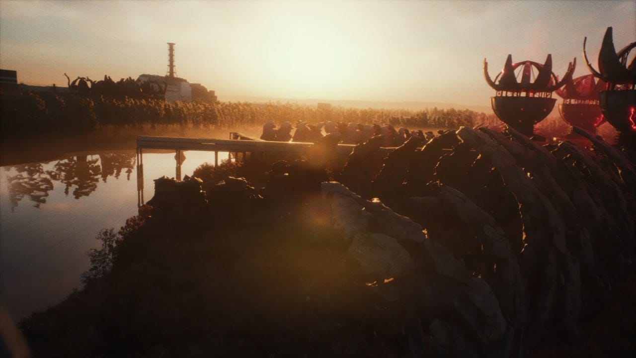 A lake with a factory on one side, a weird sphere-like building on the other bank during a bright sunset