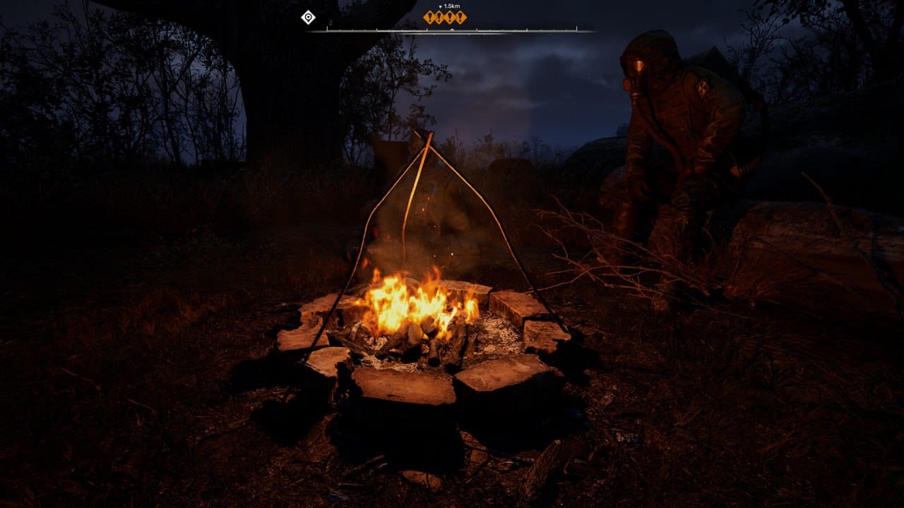 A POV sitting in front of the bonfire in the night with a fellow stalker in a gas mask sitting on the other side of the fire