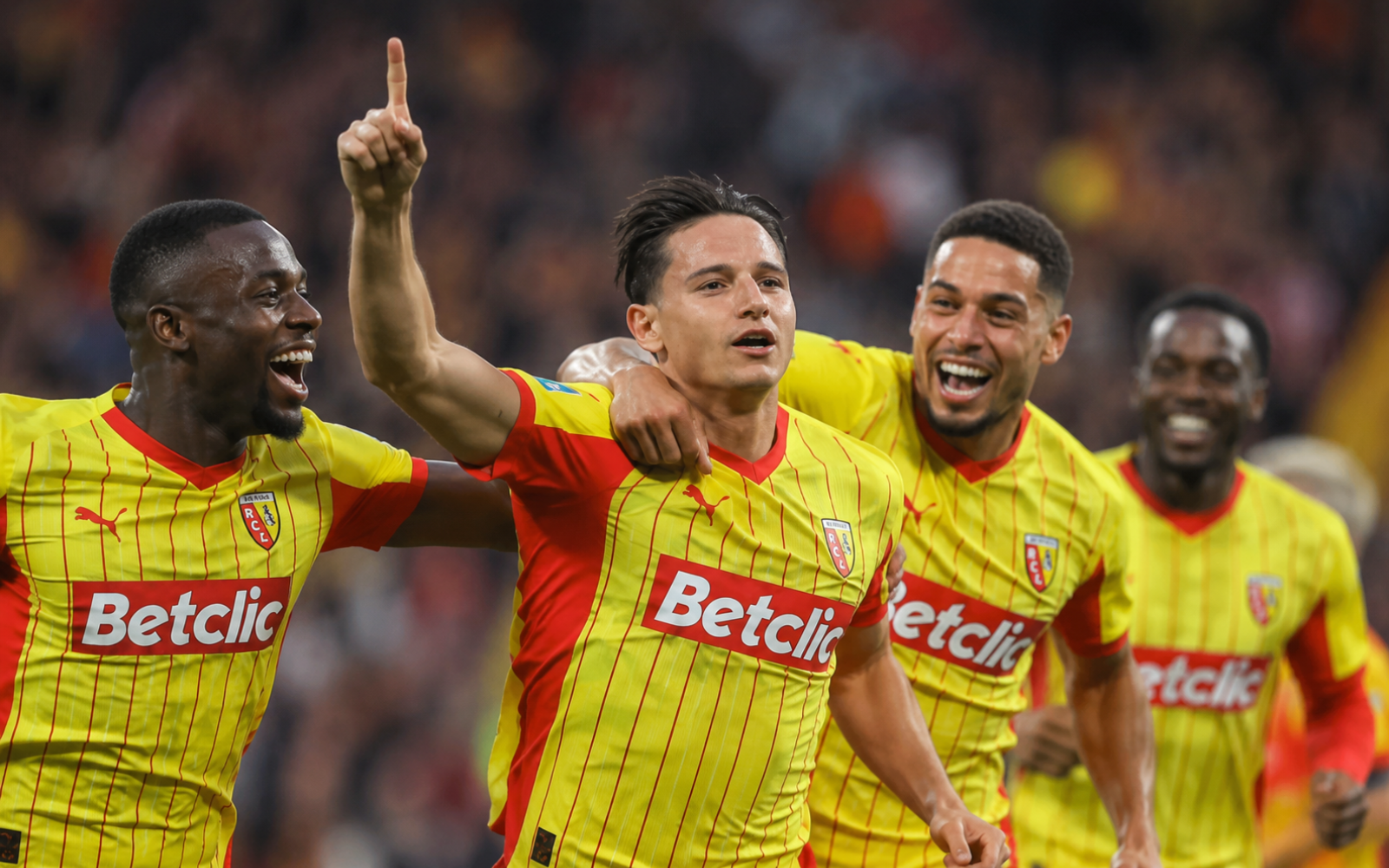 Lens players celebrate beating PSG with ten men in the 2026 Trophée des Champions.