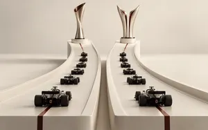 Two parallel Formula 1 championship tracks leading toward separate trophies, with black race cars representing the Drivers’ and Constructors’ title battles.