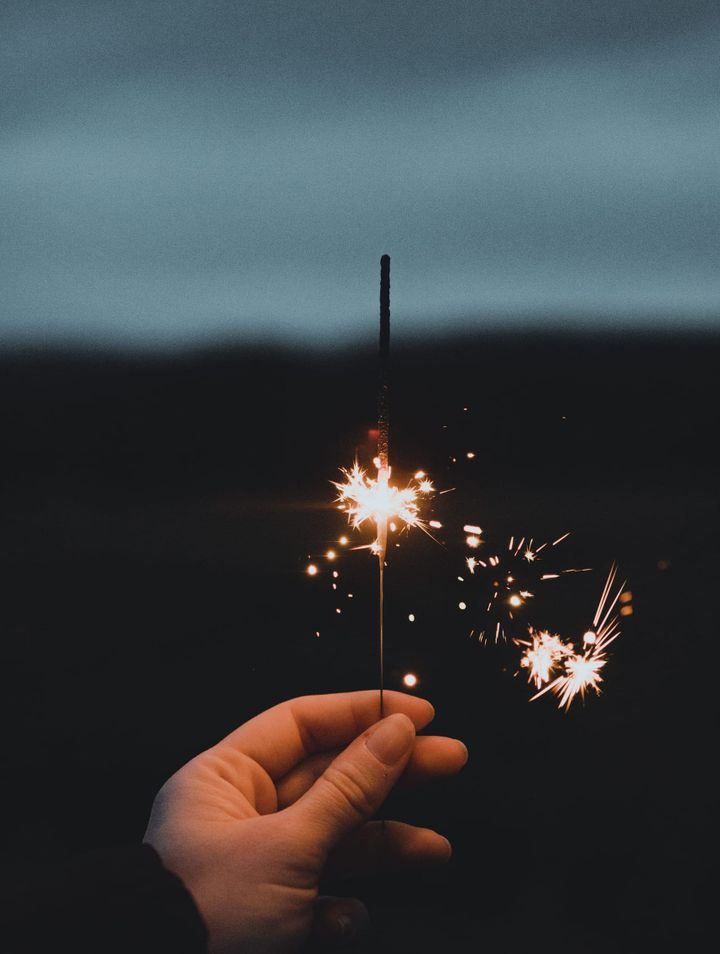 Weak, half-used single sparkler lit.